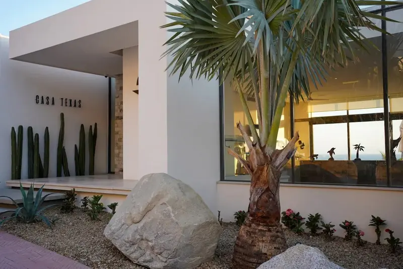 Casa Texas entrance on the white Pedregal facade