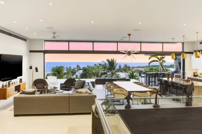Casa Texas primary suite with ocean terrace at sunset
